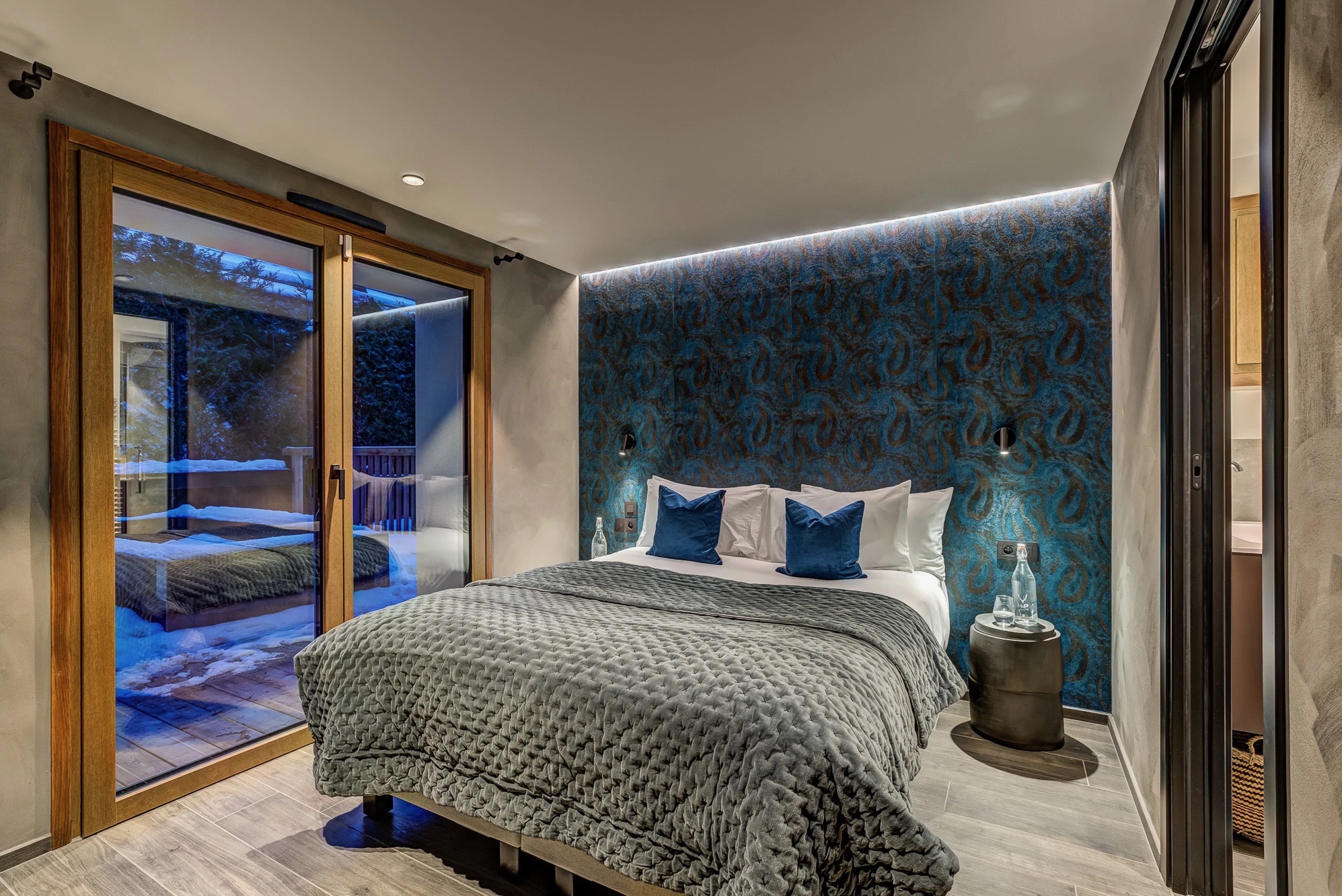 Bedroom 4 with elegant headboard and soft layered textiles