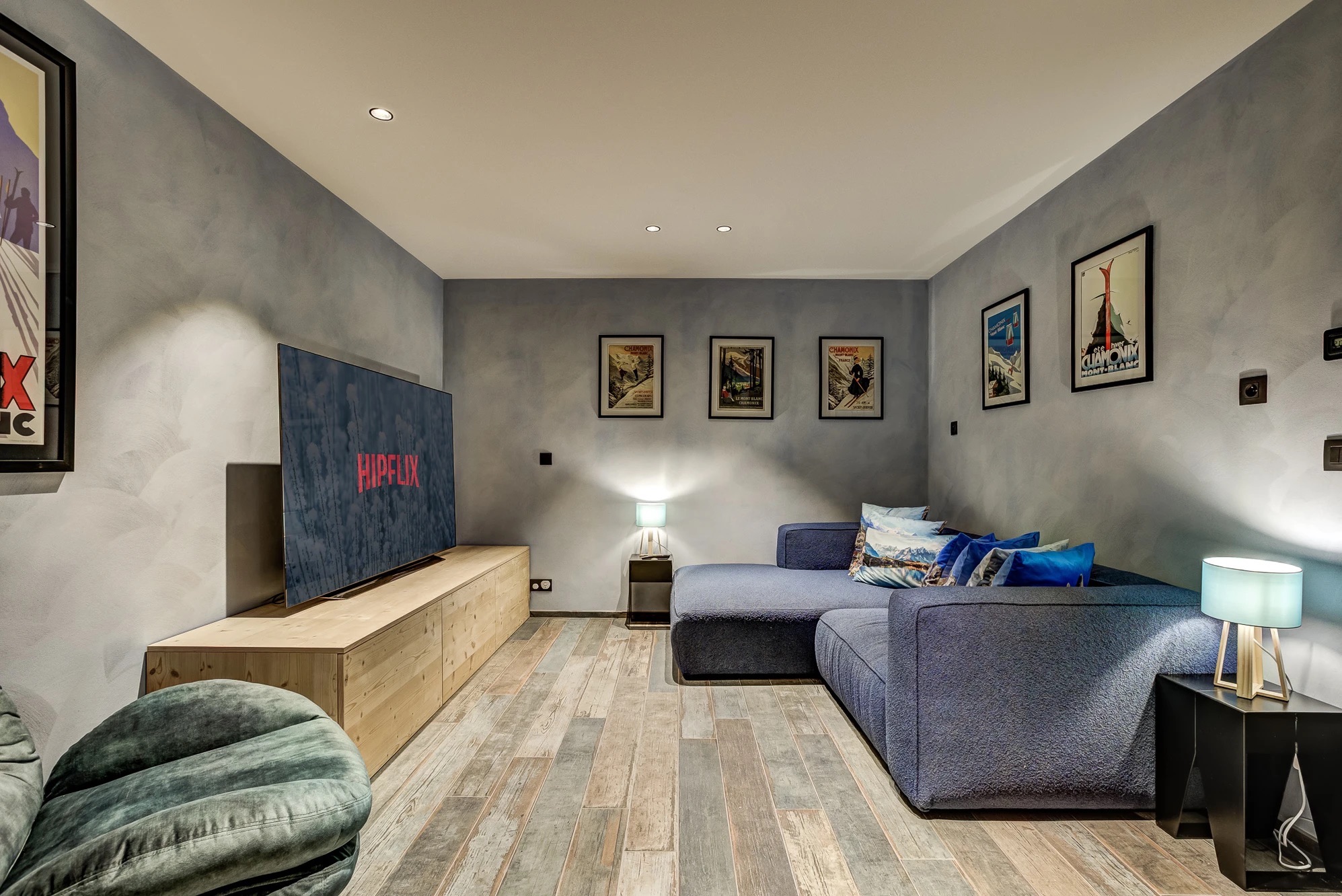 Private cinema room with tiered seating and ambient lighting