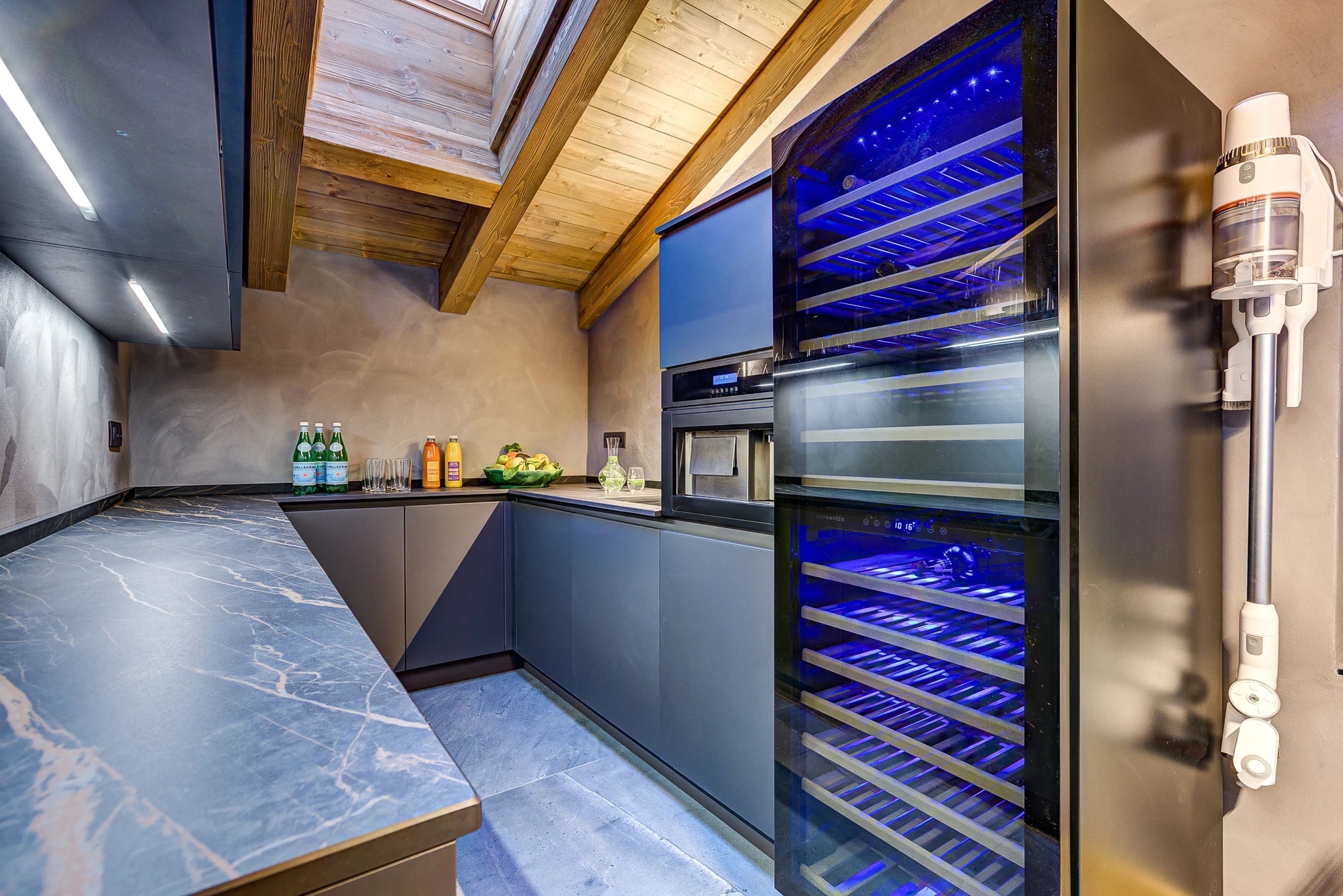 Side kitchen with bespoke joinery and natural stone counters